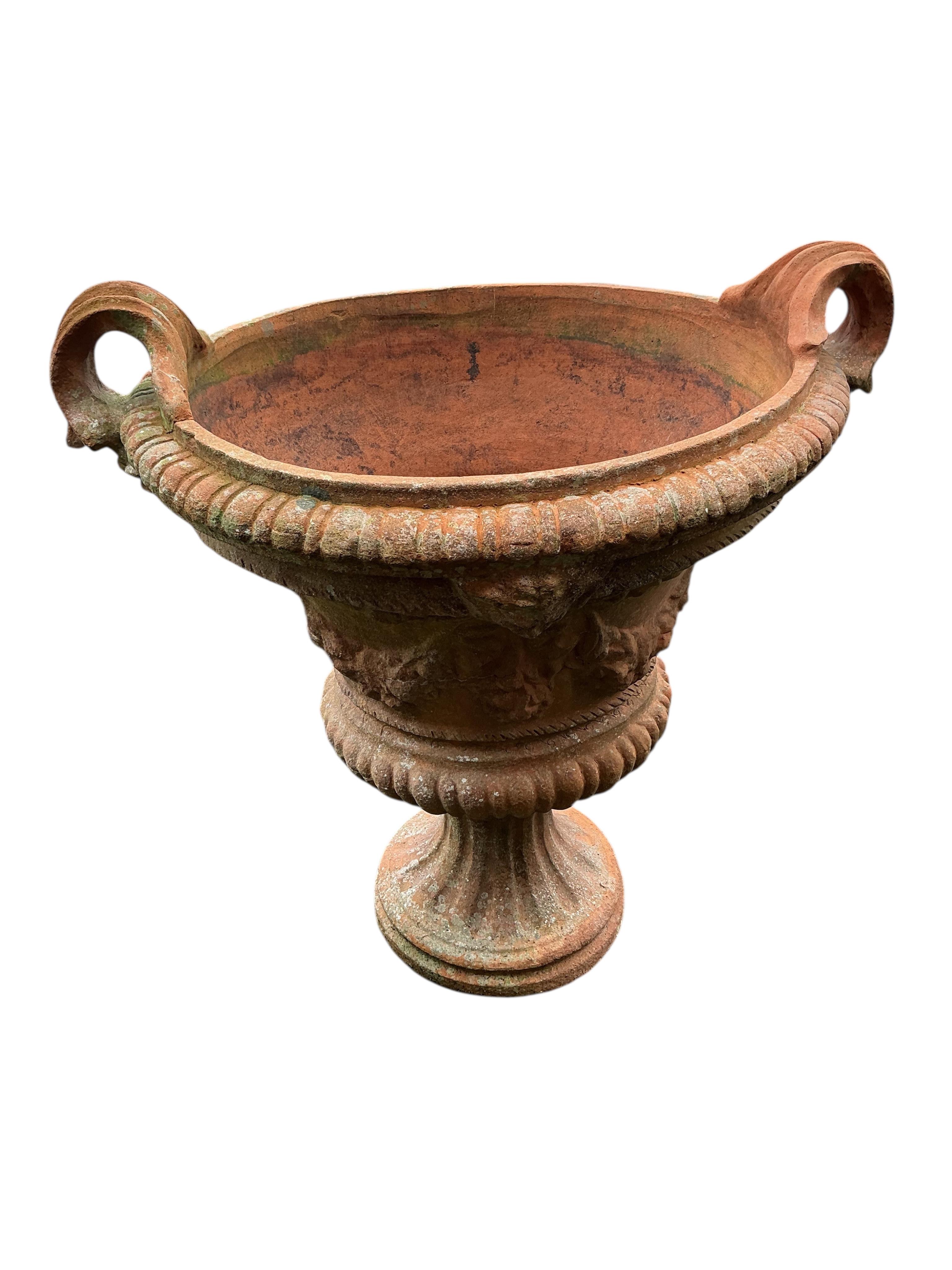 A large circular terracotta planter, diameter 72cm, height 86cm